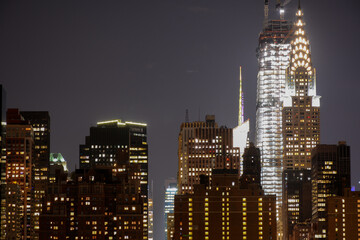 Fototapeta na wymiar NEW YORK CITY - JUNE 26, 2019: Night view to Manhattan skyline from Gantry Plaza State Park