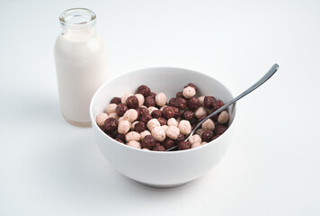 Healthy Breakfast of wheat balls and fresh milk on a light background. Side view. The concept of healthy, dietary breakfasts.