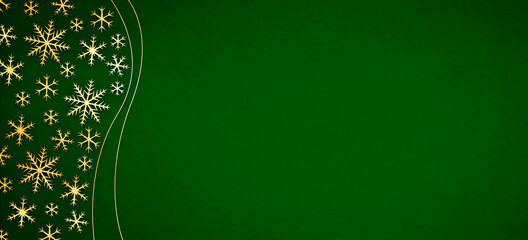 Christmas decorations with golden snowflakes shape on a dark green background. Decorative background with copy space.