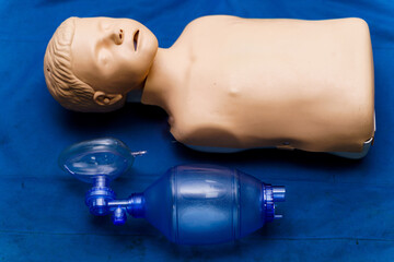 Dummy used for first medical help. Selective focus on equipment used by trainees.