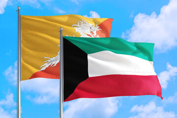 Kuwait and Bhutan national flag waving in the windy deep blue sky. Diplomacy and international relations concept.