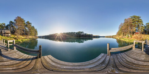 full seamless spherical hdri panorama 360 degrees angle view on wooden pier near lake in forest in evening in equirectangular projection with zenith, ready VR AR virtual reality content