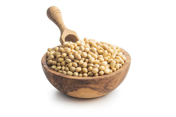 Dried soy beans in wooden bowl isolated on a white background.
