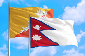 Nepal and Bhutan national flag waving in the windy deep blue sky. Diplomacy and international relations concept.