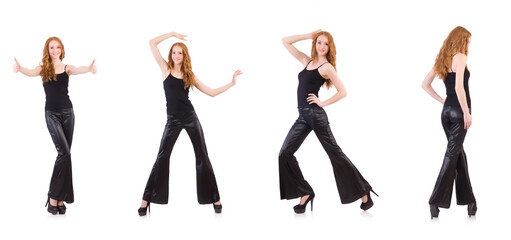 Redhead woman in black bell bottom pants on white