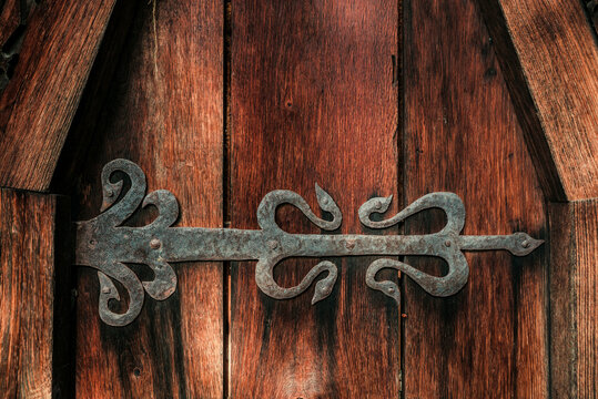 old vintage historic wood brown door with metal and wood decor 1