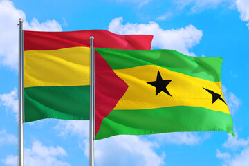 Sao Tome And Principe and Bolivia national flag waving in the windy deep blue sky. Diplomacy and...