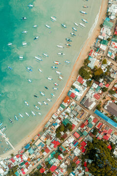Aerial view of outriggers moored in harbour, El Nido, the Philippines.