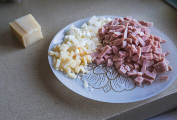 plate of york ham and cured cheese ready to eat.