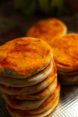 Pizza in preparation with tomato sauce. Pre Pizza ready to cook. Fast homemade restaurant food