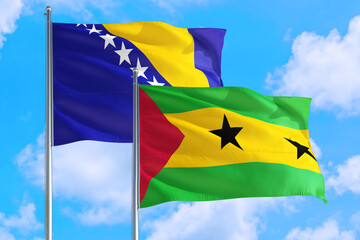 Sao Tome And Principe and Bosnia Herzegovina national flag waving in the windy deep blue sky. Diplomacy and international relations concept.