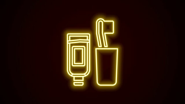 Glowing neon line Toothbrush and tube of toothpaste icon isolated on black background. Disposable bathroom supplies. 4K Video motion graphic animation