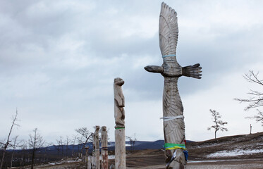 Wooden pagan idols in the form of animals - eagle, otter, seal and others guarding the sacred...