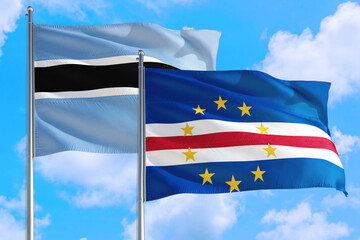 Cape Verde and Botswana national flag waving in the windy deep blue sky. Diplomacy and international relations concept.