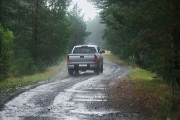 Obraz na płótnie Canvas road wet muddy of backcountry countryside in rainy day.