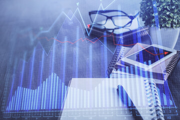 Double exposure of forex chart drawing and cell phone background. Concept of financial trading