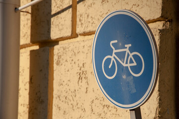 metal road sign bicycle lane and wall