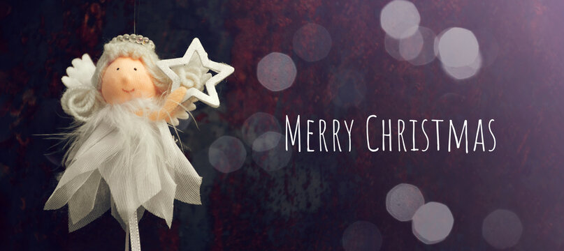 Christmas Card With Christmas Angel Holding A Star.