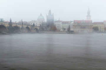 Fog over the Vltava river near Charles Bridge