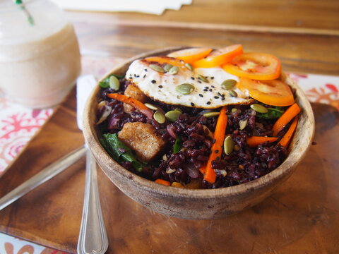 Healthy vegetable bowl with a fried egg on top, The food viewed from above, El Nido, Palawan, Philippines