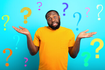 Confuse and pensive expression of a boy with many questions . cyan colored background