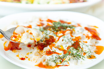 The manti meal made with meat in dough and turkey
