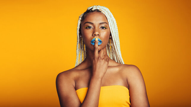 African american woman on yellow background