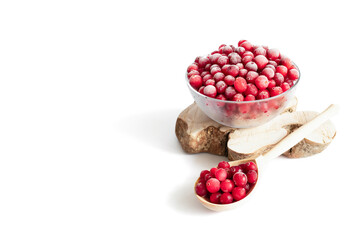 Frozen cranberry berries in a bowl isolated on a white background. Vegetarian organic food. Copy space.