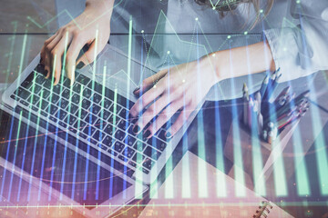 Fototapeta na wymiar Double exposure of woman hands typing on computer and forex chart hologram drawing. Stock market invest concept.