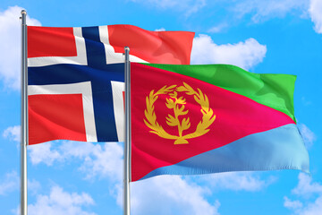 Eritrea and Bouvet Islands national flag waving in the windy deep blue sky. Diplomacy and international relations concept.