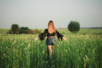 girl with dog in field