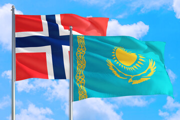 Kazakhstan and Bouvet Islands national flag waving in the windy deep blue sky. Diplomacy and international relations concept.