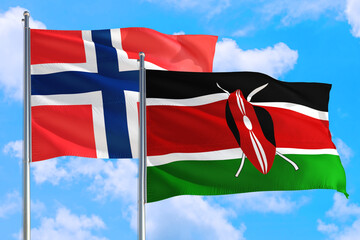 Kenya and Bouvet Islands national flag waving in the windy deep blue sky. Diplomacy and international relations concept.