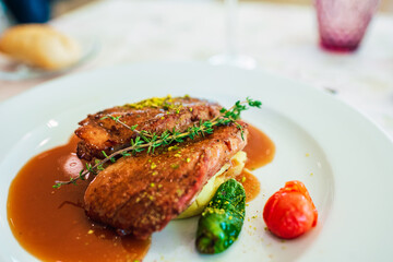Grilled chicken fillet washed down with a herb sauce.