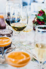 Glasses arranged on the diners table at a celebration of a party.