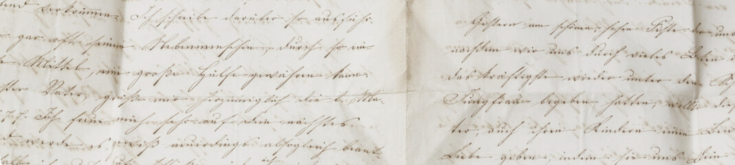 closeup of old handwriting; vintage paper background