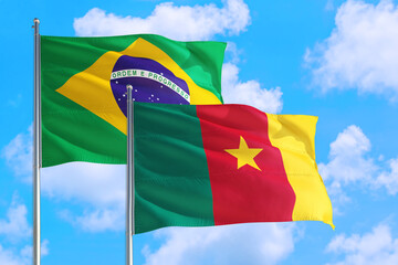 Canada and Brazil national flag waving in the windy deep blue sky. Diplomacy and international relations concept.