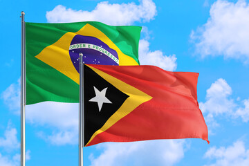 Ecuador and Brazil national flag waving in the windy deep blue sky. Diplomacy and international relations concept.