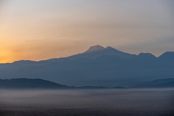 Fototapeta na wymiar Sunrise with the mist over the river and the plain in Kayseri, in front of Erciyes mountain