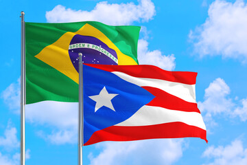 Qatar and Brazil national flag waving in the windy deep blue sky. Diplomacy and international relations concept.