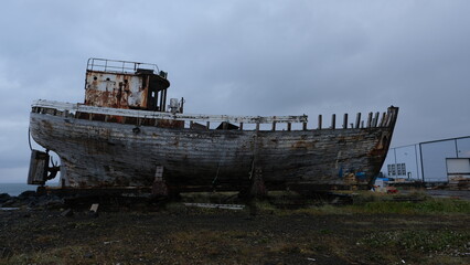 Fototapeta na wymiar Shipwreck decaying in Akranes (Iceland).