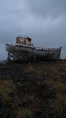 Fototapeta na wymiar Shipwreck decaying in Akranes (Iceland).