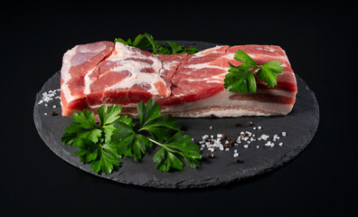 Pork belly on a black stone tray