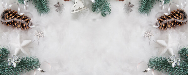 Naklejka na ściany i meble New Year's and Christmas layout of pine branches and decor in the snow with a copy space. Winter holidays frame flat lay