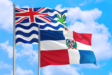 Dominican Republic and British Indian Ocean Territory national flag waving in blue sky. Diplomacy and international relations concept.