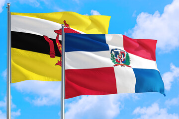 Dominican Republic and Brunei national flag waving in the windy deep blue sky. Diplomacy and international relations concept.