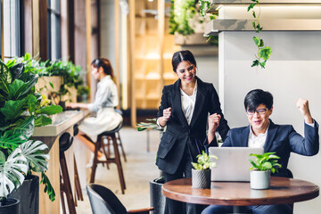 Group of professional business discussing meeting strategy sharing ideas thoughts with project.Creative business people working with laptop computer in green plant terrace decorated modern workloft