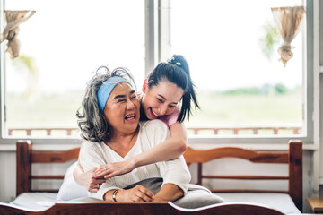 Portrait of enjoy happy love asian family senior mature mother and young daughter smiling laughing...