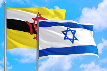 Israel and Brunei national flag waving in the windy deep blue sky. Diplomacy and international relations concept.