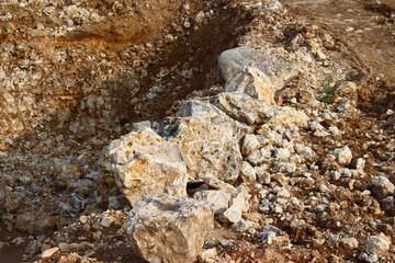 Large limestone boulders in a limestone quarry, extraction of building material

